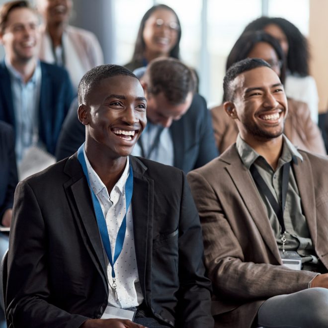 Shot of a group of businesspeople attending a conference